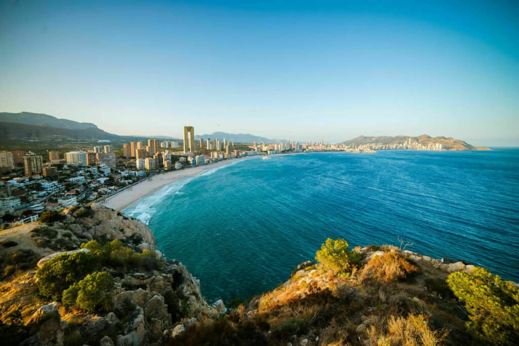 Breathtaking view of the coastline in Benidorm with high buildings, mountains and sea Breathtaking view of the coastline in Benidorm